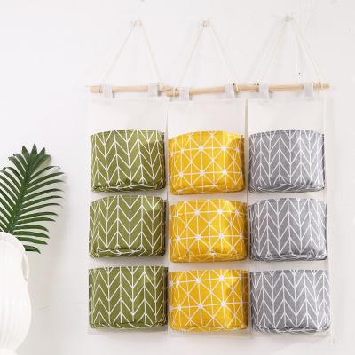 China Sustainable Cotton And 3 Layer Hanging Bag Pouch Fabric Storage Sundries Bag for sale