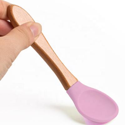 China BPA Free Rainbow Babies Early Thinning Training Spoon Silicone Feeding Wooden Handle Spoons Patchwork Spoon Fork for sale