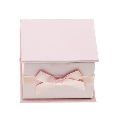 China Recycled Materials Customized Small Luxury Magnetic Pink Cardboard Box Skin Care Cosmetic Jewelry Packaging Box With Bowknot for sale