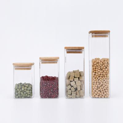 China Multifunctional Food Square Glass Jars 250ml 350ml 550ml Clear Borosilicate Cookie Honey Nuts Glass Storage Jar With Bamboo Wooden Lid for sale