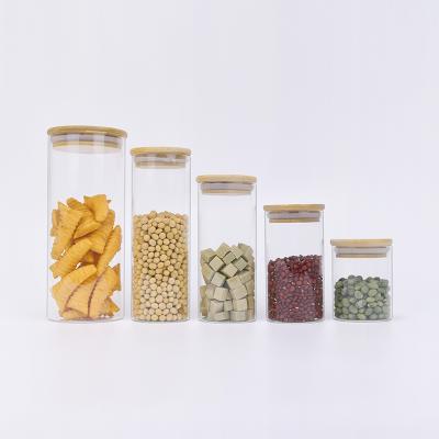 China Multifunctional new trend large food storage glass jar with airtight wooden lid, glass storage canisters container for sale