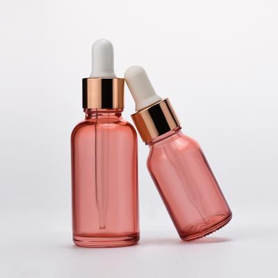 China Free Samples 5ml 10ml 15ml 20ml 30ml 50ml 100ml Multifunctional Pastel Cosmetic Essential Oil Dropper Transparent Glass Pink Bottles for sale