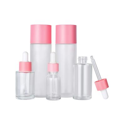 China 5ml 10ml 15ml 20ml 30ml 50ml 100ml 120ml 150ml Clear Clear Multifunctional Matte Flat Shoulder Gel Essential Oil Dropper Glass Bottle With Pink Lid for sale