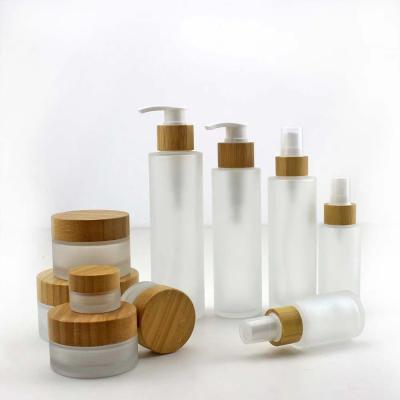 China 100ml 120ml 150ml Multifunctional Wholesale Empty Shampoo Glass Bottle With Bamboo Pump for sale