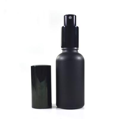 China Multifunctional empty refillable matte black 30ml 50ml 100ml perfume glass spray bottle with aluminum spray pump cap for sale