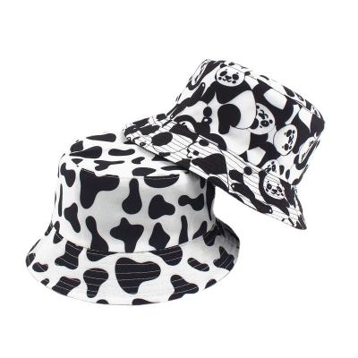 China Outdoor Sun bucket hat Japan and Korean women's summer style cow pattern printing bucket hat double-sided new hat men's for sale