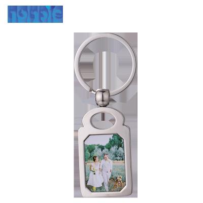 China DIY Photo Box Package Key Chain Wholesales More Form Metal Sublimation Mute Key Chain for sale