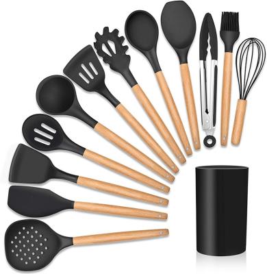 China Sustainable Kitchen Accessories Silicone Stick Cookware Non Sets Kitchen Utensil With Wooden Handle for sale