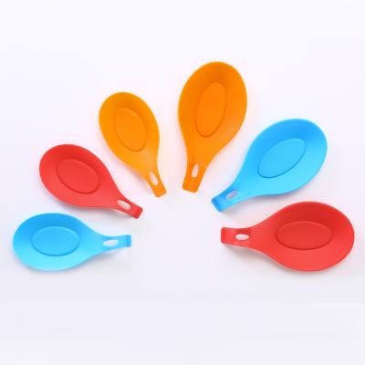 China Pocket Sized Large Holder Silicone Almond Form Kitchen Utensil Soup Spoon Heat Resistant Rest for sale