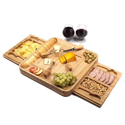 China Sustainable Bamboo Cheese Board with Wooden Cutlery Set Charcuterie Tray and Meat Serving Board with Slide-Out Drawer for sale