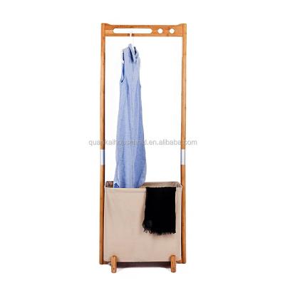 China Expandable Garment Rack, Segarty Bamboo Clothing Rack with Foldable Laundry Basket - Portable Clothes Hanging Rack - Home Closet Storage for sale