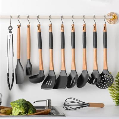 China Logo Cooking Set Kitchen Accessories Customized Viable 11 Piece Silicone Kitchenware Utensils Set With Wooden Handle for sale