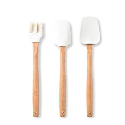 China Viable Wholesale Food Grade Set of 3 Tools Baking Silicone Oil Sweeps Spatula Cake Scrapers with Wooden Handle for sale