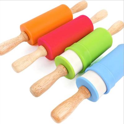 China Non-Stick Viable Food Grade Flour Dough Roller For Dumpling Silicone Rolling Pin With Wooden Handle for sale