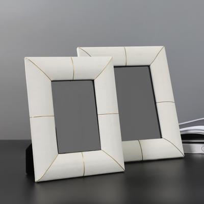 China Modern Luxury Lady Wood Leather Desktop Picture Frame Photo Frame Home Decoration For Sale Modern Beige Stainless Steel Polyfoam And Cardboard for sale