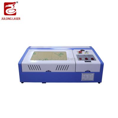 China Laser CUTTING construction material shops fast speed 500mm/s automatic wood cutting machinery repair shops machinery zippo igniter for sale