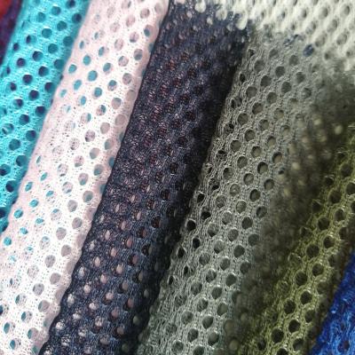 China Hot Selling Polyester Stretch Mesh Fabric 3*1 FDY Warp Hole High Quality 100% Knitting Mesh Fabric For Covering/Bags/Hat Garment/Clothing for sale