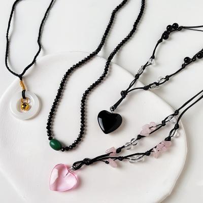 China Heart Shaped Crystal Pendant Necklaces Natural Stone Necklaces Charm Jade Bell Ring Lucky Pink Love Trendy Red Black Onyx Heart Shaped Necklaces for sale