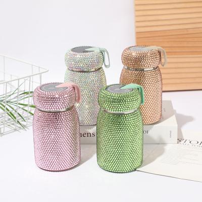 China Luxury Bling Automotive Handcraft Stainless Steel Water Bottles with Lids and Straws Diamond Full Rhinestone Reusable Coffee Cups for Chris for sale