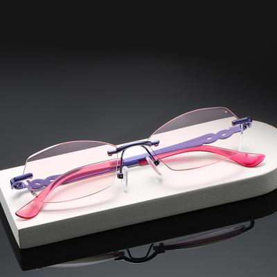 China 2022 New Design Anti Rimless Thin Blue Light Reading Glasses Women Rimless Red Optical Frame for sale