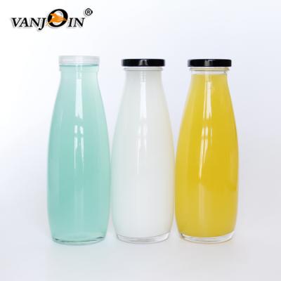 China Beverage Round 500ml Clear Glass Milk Bottle Komucha Glass Bottles With Twist Off Cap for sale