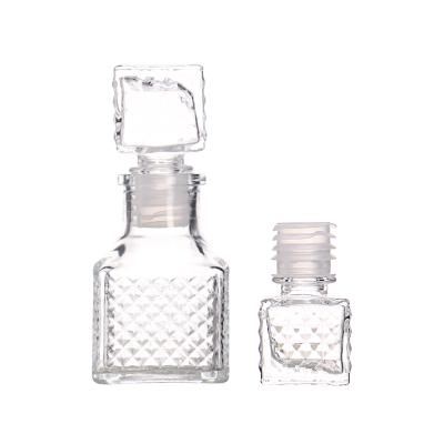 China 50ml Small Clear Glass Aroma Christmas Wine Bottle With Glass Glossy Caps Square Shape Wine Bottles for sale