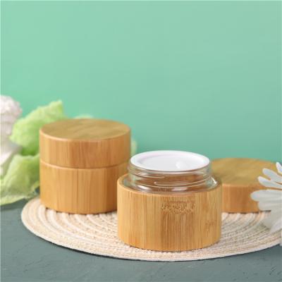 China Personal Care Wholesale High Quality 50ml Bamboo Cosmetic Jars Bamboo Glass Face Cream Jars Containers for sale