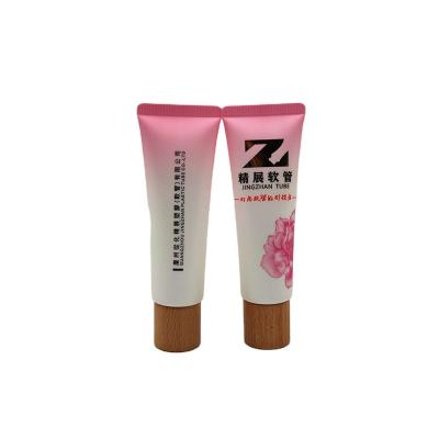 China Wholesale Cosmetic Squeeze Tubes Hand Cream Container Wooden Plastic PE ACP Cosmetic Packaging Squeeze Tube Base Empty Packaging for sale