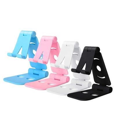 China 2021 New Arrival Foldable Plastic Desktop Mobile Phone Holder Adjustable Tablet PC Multifunctional Lazy Plastic Mobile Phone Holder for sale