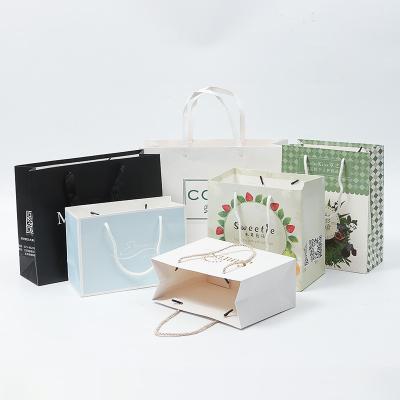 China Recyclable Custom Luxury Cosmetics Gift Wrapping Paper Bag Shopping Bag With Logo for sale