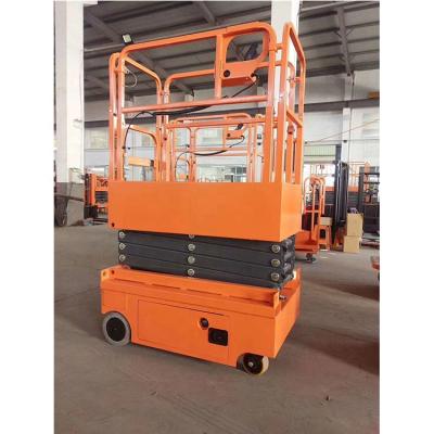 China Hotels Portable Hydraulic Self Propelled Electric Scissor Lift Platform With Battery Power Supply for sale