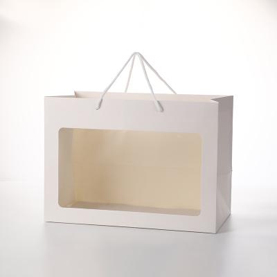 China Creative Recyclable INS Style Open Window Flower Paper Gift Bag With Your Own Logo for sale