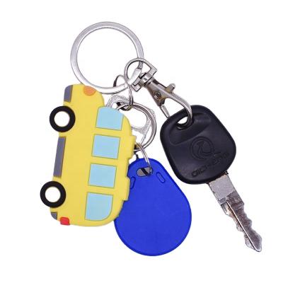 China Custom promotional cute metal logo 3d cartoon car transports personalized soft pvc rubber key chain for sale