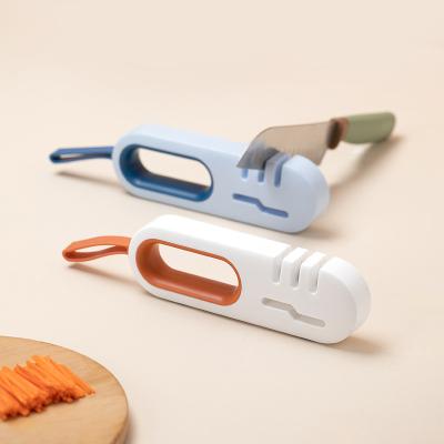 China Multifunctional Disposable Four-in-One Knife Sharpener Kitchen Household Knife Scissors Sharpening New Artifact Fast Manual Knife Sharpener for sale