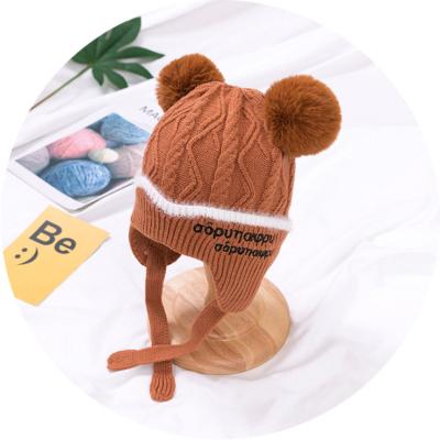 China Modern cheap children's double pompom knitted hat for knitting embroidered beanie ear protector baby hat for sale