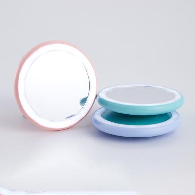 China Double Sided Make Up LED Mirror Cosmetic Folding Portable Compact Pocket LED Lighted Makeup Mirror for sale