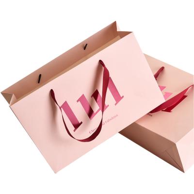 China New Recycled Materials Matt Gift Packaging Cosmetic Paper Bag With Ribbon Rope Handles Shopping Bag Custom Paper for sale