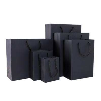 China Recycled Materials Boutique Packaging Gift Bag Luxury Custom Printed Matte Black Paper Shopping Bags for sale