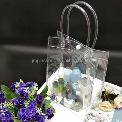 China Fashion transparent PVC waterproof cosmetic bag with handles for sale