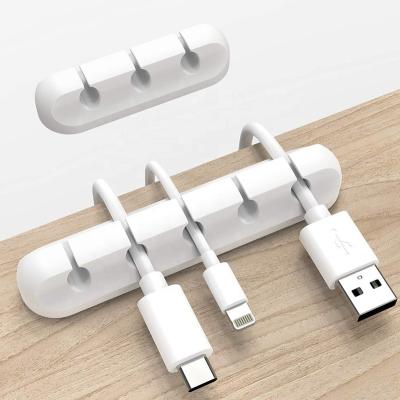 China Eco-Friendly Promotional Custom Logo USB Cable Area Cord Organizer Clips Silicone Wire Holder For Home Office for sale