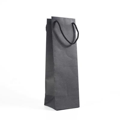 China Stock Materials Hot Sales Recycled Card Bottle Black Paper Bag With Embossing For Packing Wine Or Other Gifts for sale