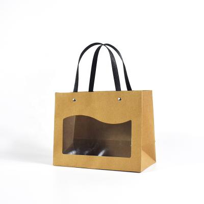 China Hot Selling Recyclable Brown Kraft Paper Stock Horizontal Bag With Transparent PVC Window For Packing Gifts for sale