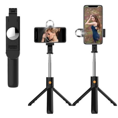 China Portable Flexible 360 ​​Degree Rotation Wholesales Transmission K10 Mobile Phone Tripod Wireless Selfie Stick With Light Mirror for sale