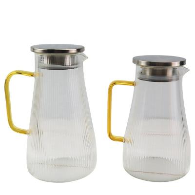 China Sustainable Transparent Glass Water Jar Tea And Juice Pitcher With Glass Handle For Home And Cafe for sale