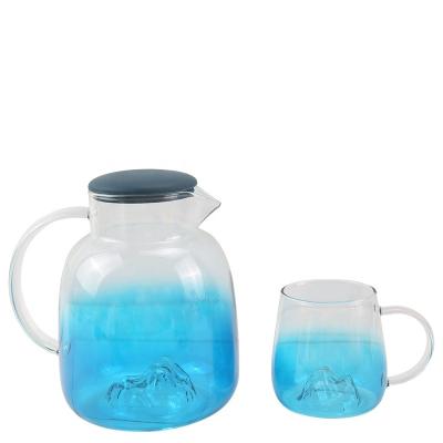 China New Sustainable Sea Blue Color And Transparent Glass Teapot Set Cold And Hot Drink Pot With Rubber Lid for sale