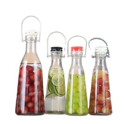 China Beverage Seal Glass Airtight Rubber Clear 16 oz 500ml Empty Clear Swing Top Beer Glass Bottle With Wire Easy Swing Cap for sale