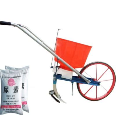 China Agricultural hand push seeder multi-function single wheel fertilizer spreading hand push cultivator zu verkaufen