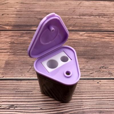 China Plastic + Metal Double Holes Triangular Bucket Plastic Pencil Sharpener With Lid for sale