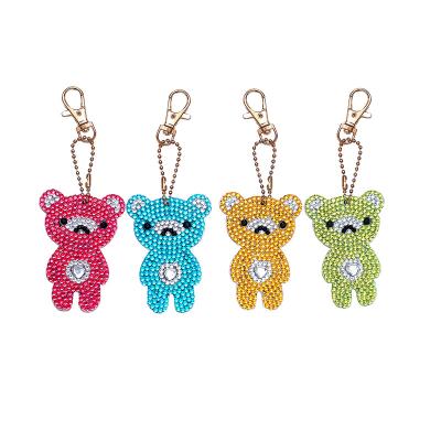 China Three Little Rings Durable Teddy Bear Custom Logo Other Chains Spray Cute Girl Diamond Painting Bike Shape Key Chain for sale