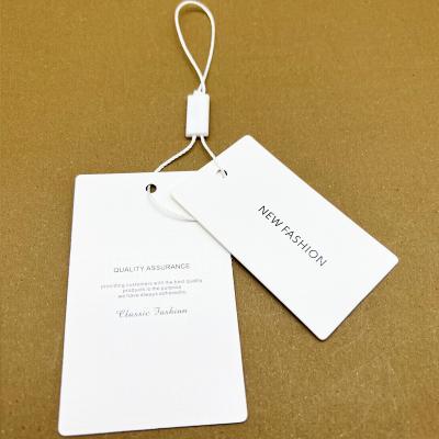 China Sustainable / Recyclable Custom Own Brand Logo Paper PVC Jeans Paper Hangtags Customize Clothing Paper Tag for sale